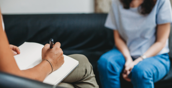 Counselling session, woman talking to counsellor in the studio