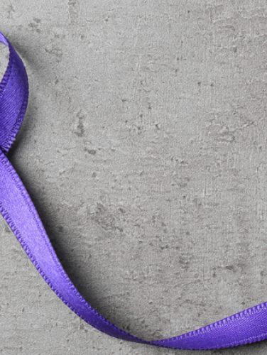 A purple ribbon for showing support in the fight against domestic violence.